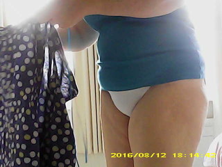 Mature wife pulls on pants and skirt