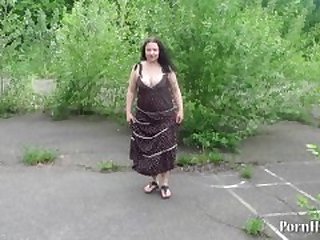 mature woman urinating in a public place